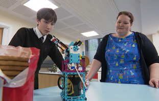 George and teacher with his biscuit dunker