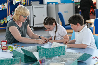 Teacher and pupils with kit box